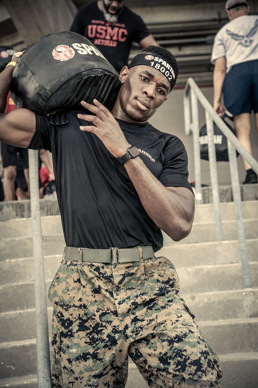 Carrying the sandbag up the stadium stairs at the Spartan Stadion