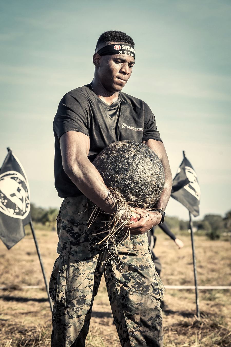 Carrying the stone between Spartan flags at the Spartan Super